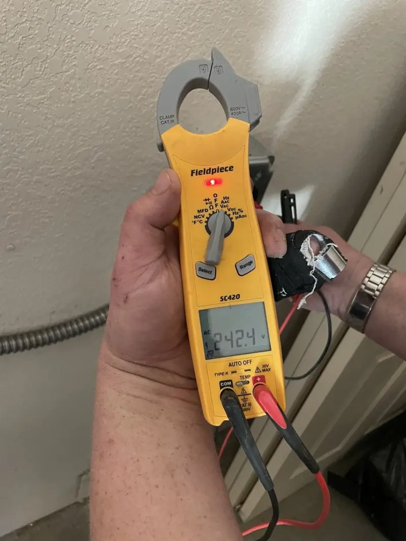 Voltage testing with clamp meter during Electrical Installation Services in Orange City
